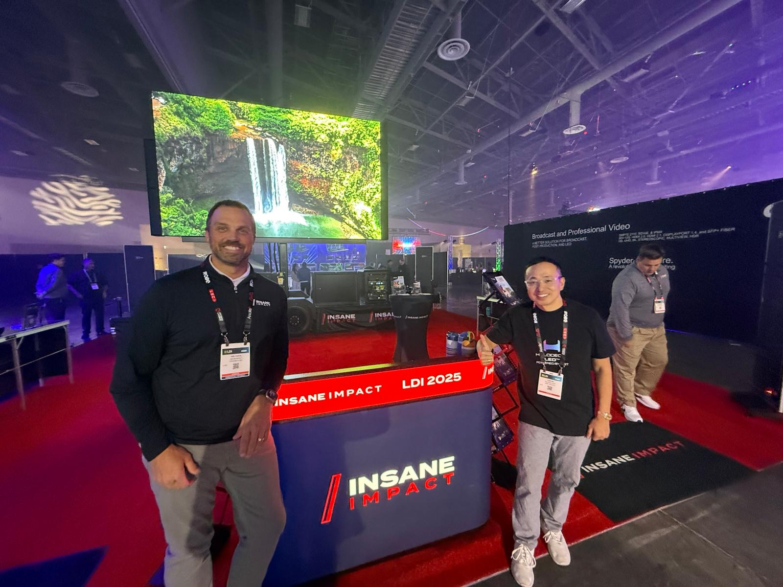 John Hu and Tod Puetz with the HoloPodium at the INSANE IMPACT booth, LDI 2025