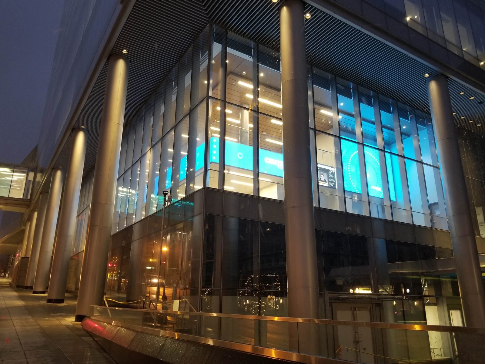 HOLODECK LED display glowing through the Centene HQ glass lobby at night, St. Louis