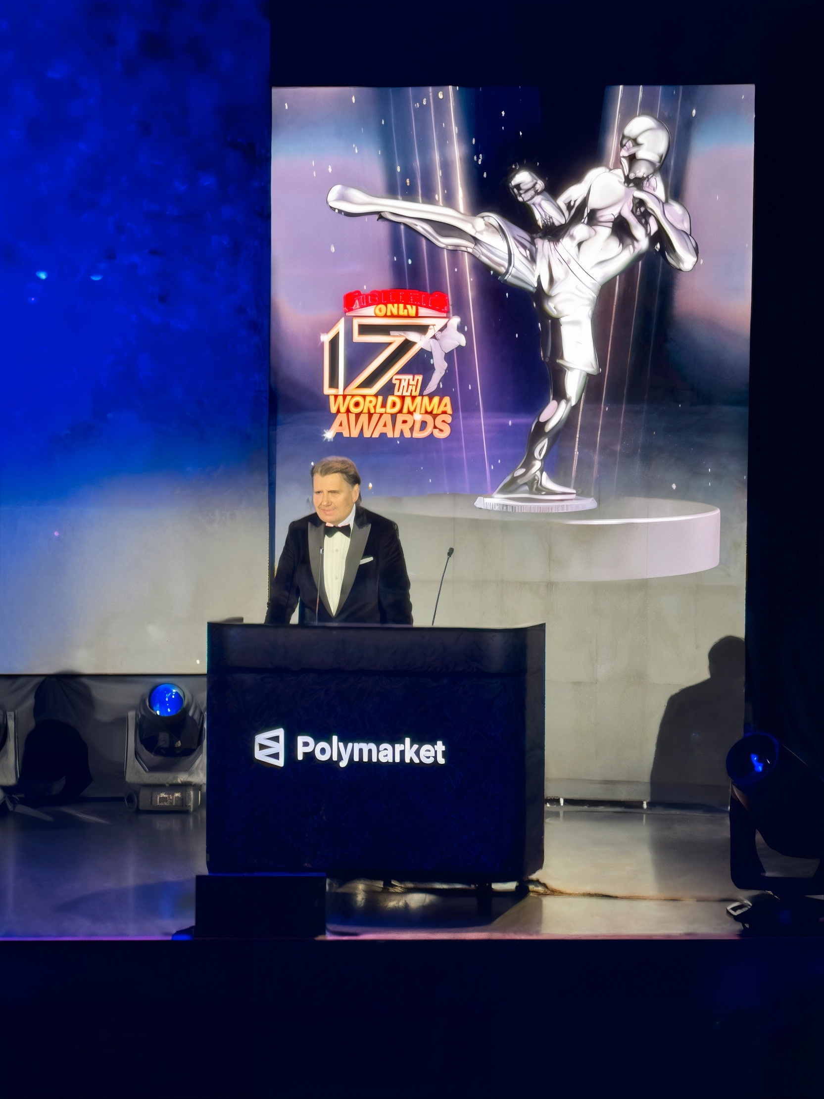 Presenter at the HOLODECK HoloPod™ podium, branded for Polymarket, 17th World MMA Awards