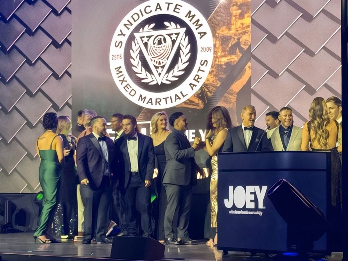 Winners and presenters on stage at the 17th World MMA Awards, in front of a HOLODECK LED wall