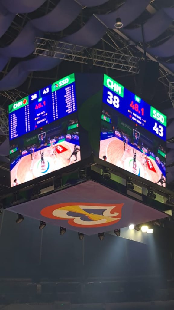 Center-hung LED scoreboard displaying a live basketball game at Smart Araneta Arena