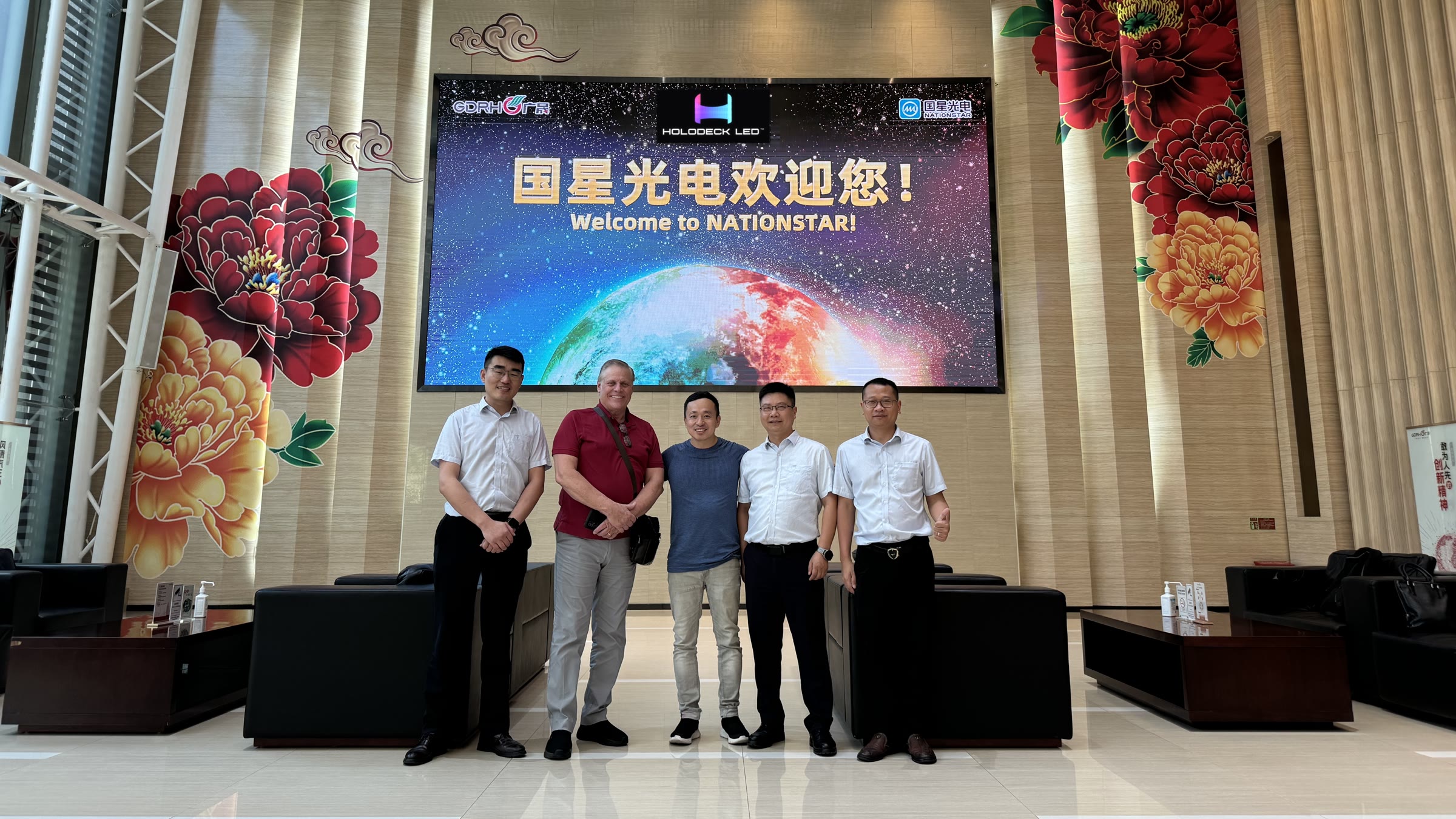 John Hu and Brian Evans of HOLODECK LED with NationStar General Manager Mr. Qin and Mr. Xie and Mr. Ma of the RGB LED Business Unit in the NationStar lobby
