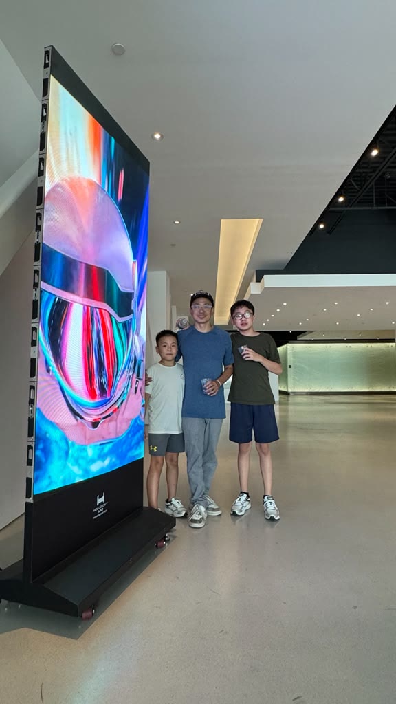 HoloTotem free-standing LED poster in the HOLODECK LED showroom