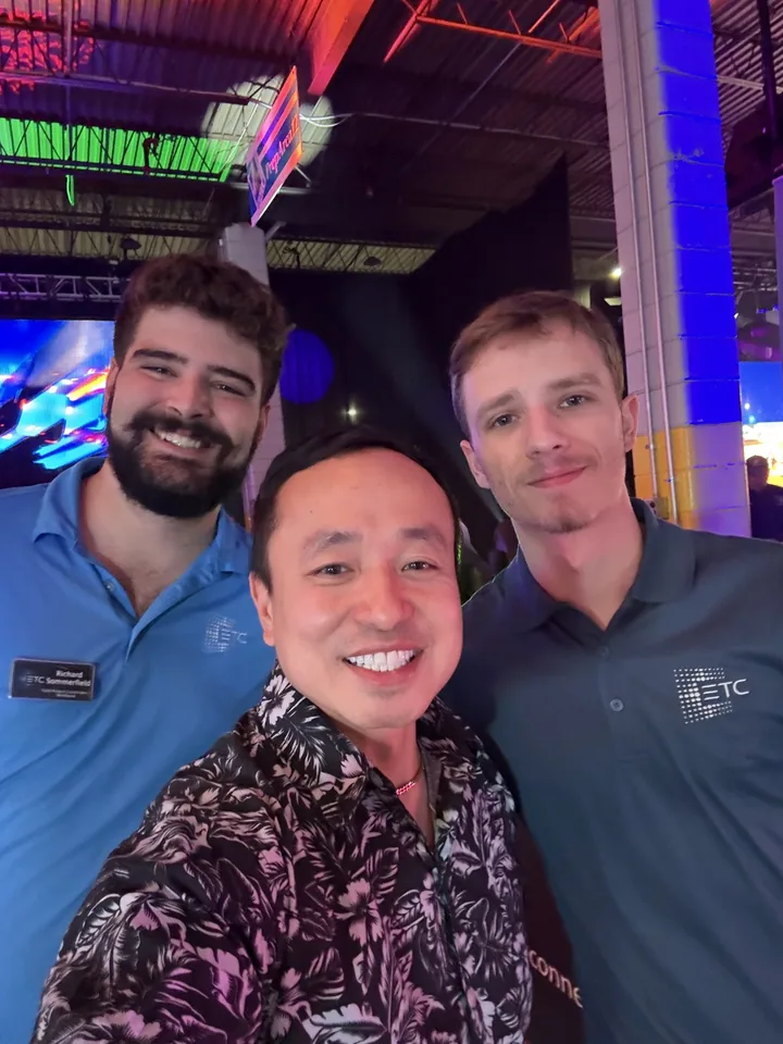 Three friends taking a selfie at an event