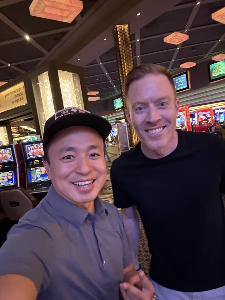 Two men taking a selfie in a restaurant