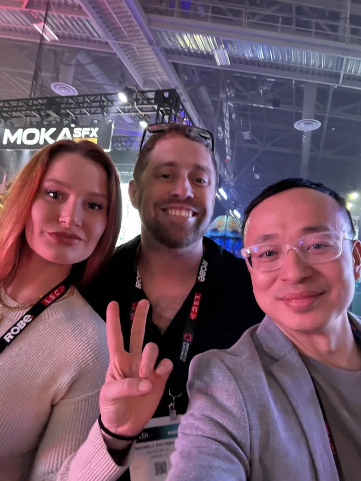 Three event attendees taking a selfie