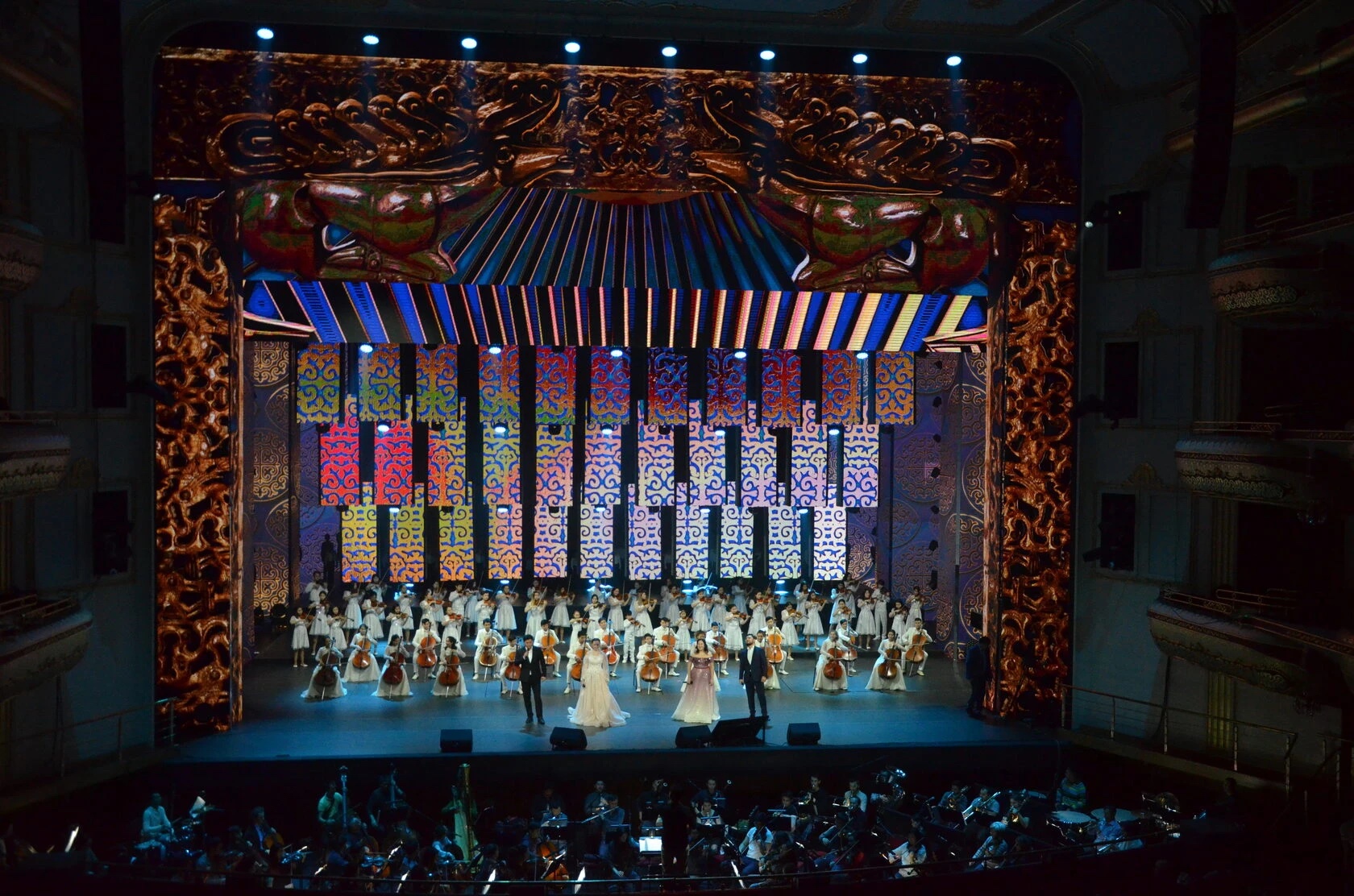 Concert stage framed by Show Screen LED walls, with a youth orchestra and soloists